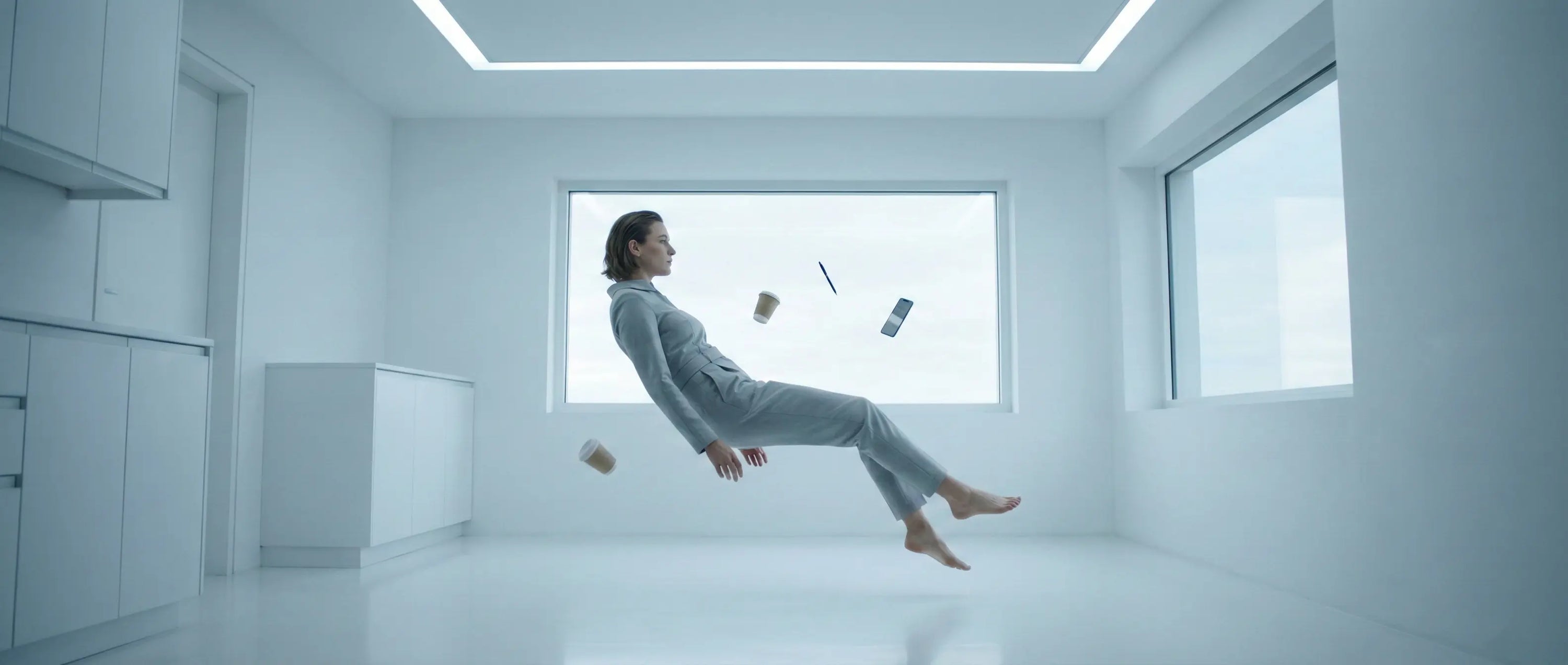 Cinematic photography of a person floating in zero gravity with suspended objects, symbolizing the feeling of dissociation and being spaced out.