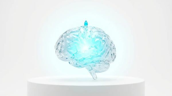 A single glowing blue drop touching a clear glass brain and instantly turning the entire structure into a radiant cyan light, visualizing the high potency of a Huperzine A micro-dose.