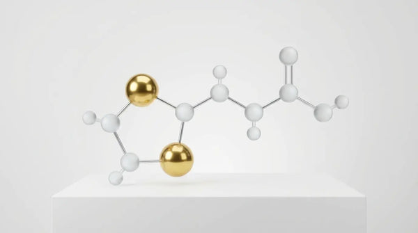 A minimalist 3D model of the Alpha-Lipoic Acid molecule made of polished gold and frosted glass, visualizing the specific chemical structure that distinguishes it from Omega-3s.